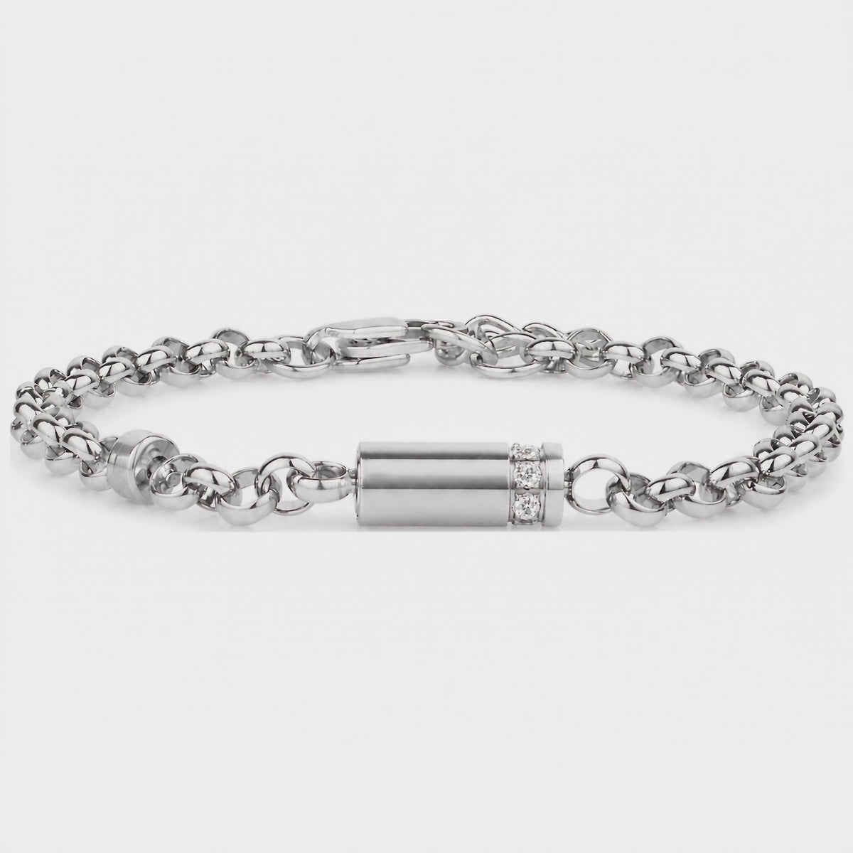 Video of a silver stainless steel lab diamond urn bracelet on a rolo link chain, showing the cylindrical memorial capsule with a row of lab diamonds and lobster clasp
